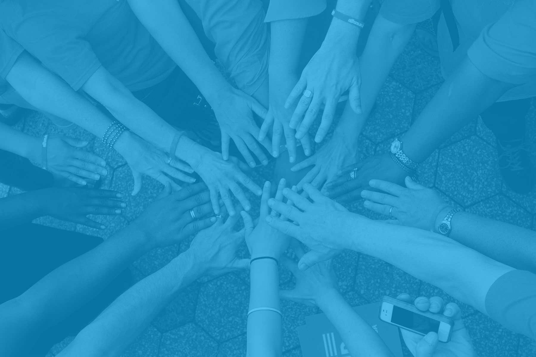 Hands joined together in a circle, a generic image of community support